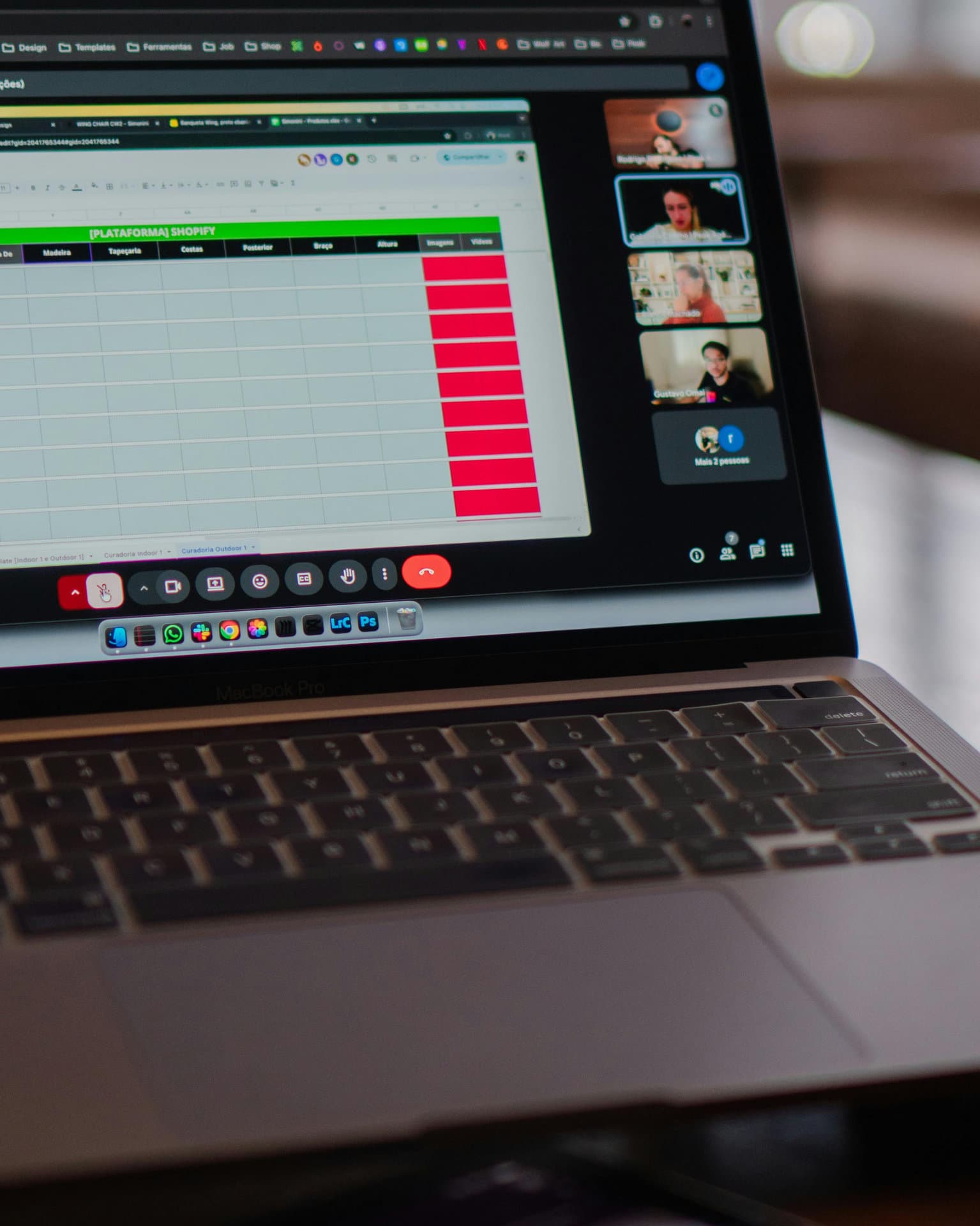 A laptop showing a shared spreadsheet during a video meeting