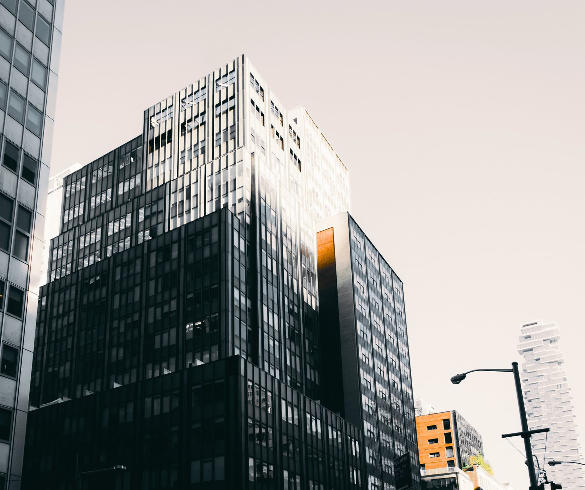 Office towers in a U.S. city against a pale sky